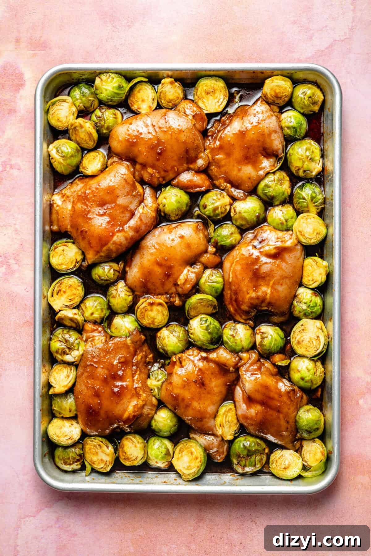 chicken thighs and brussels sprouts on a sheet pan