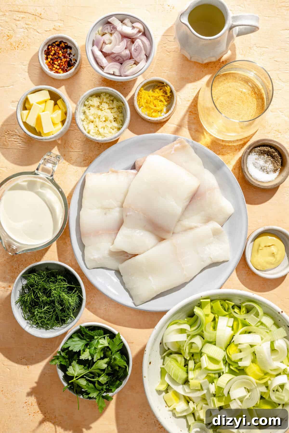 a flat-lay of ingredients to make poached halibut with creamy leeks