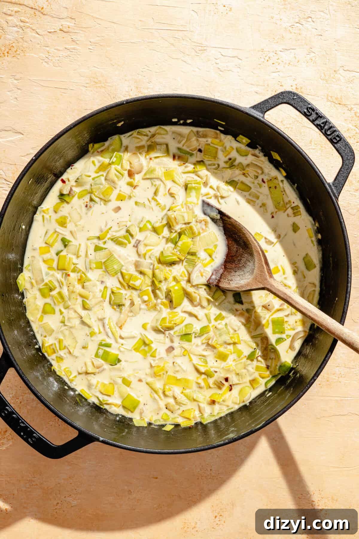 a deep cast iron skillet with creamy leeks