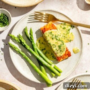 Pan Seared Salmon with Lemon Chive Beurre Blanc Recipe 7 an up-close photo of seared salmon with lemon chive beurre blanc and asparagus stalks