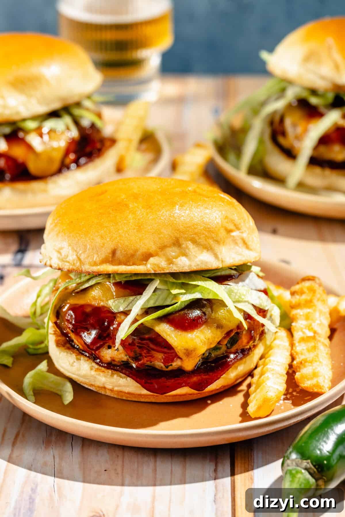 Grilled Jalapeno Cheddar Turkey Burgers Recipe 6 up-close shot of jalapeño cheddar turkey burgers on a plate with french fries