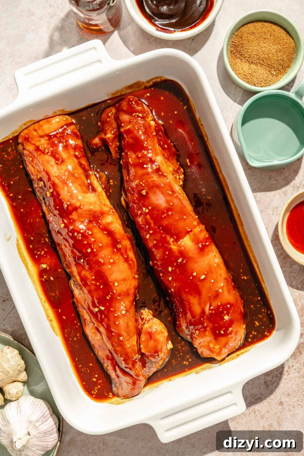 Grilled Pork Tenderloin Bowls with Hoisin Glaze 4 marinated pork tenderloins in a white baking dish