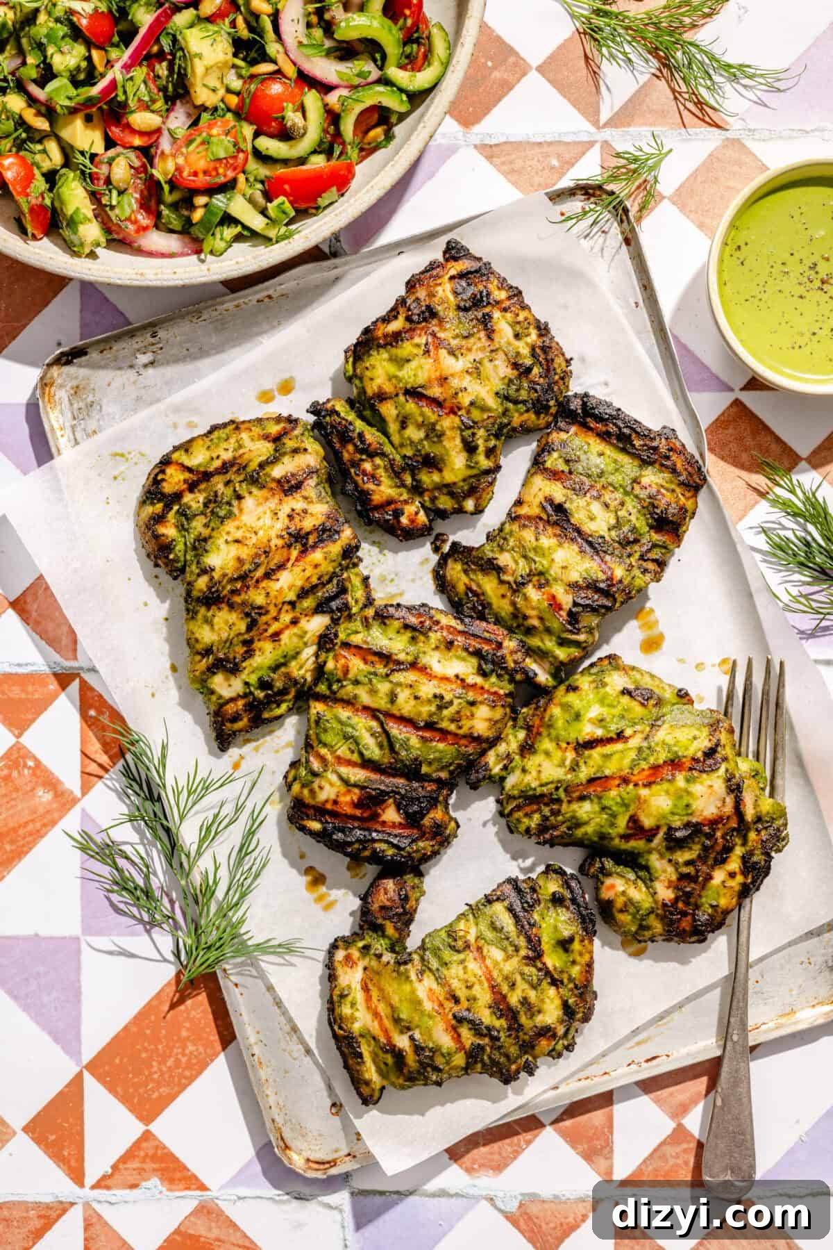 Grilled Chicken Thighs with Green Goddess Summer Salad 5 grilled green goddess chicken thighs on a platter