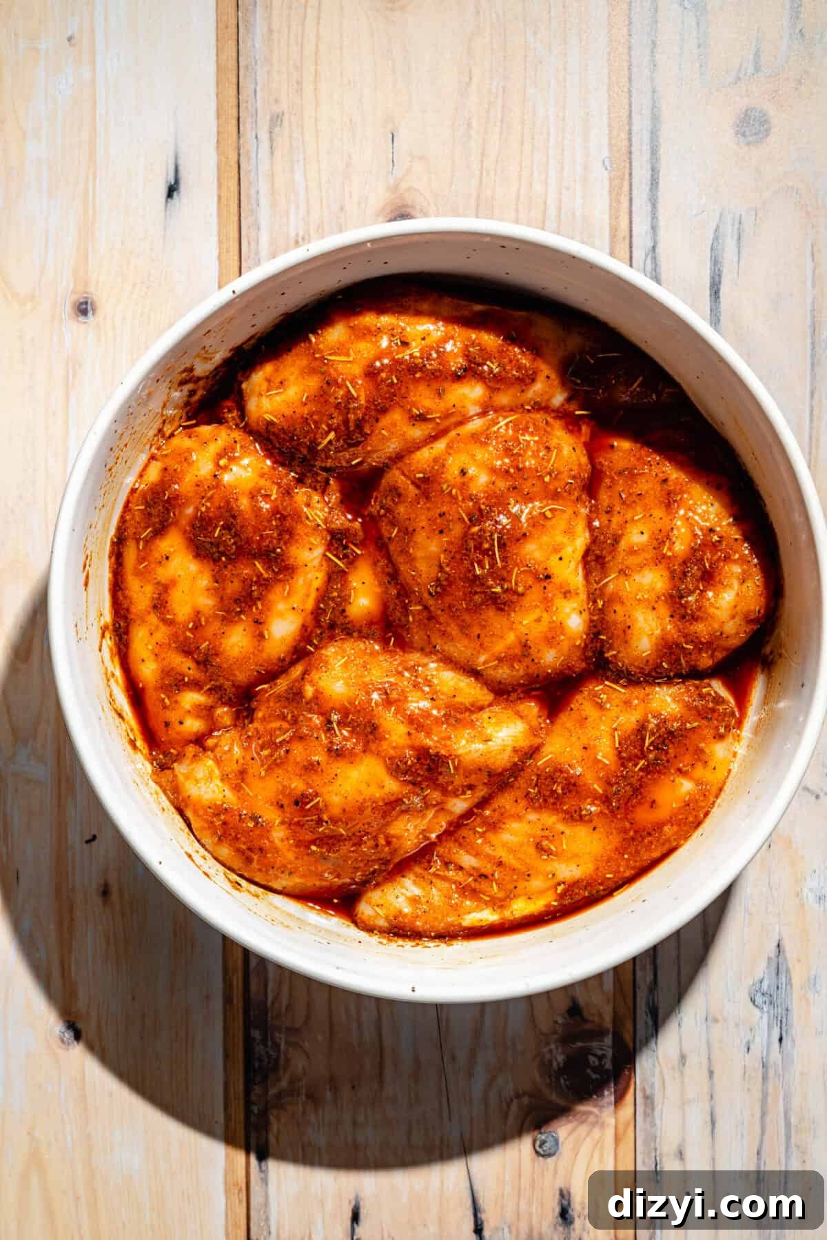 Smoky Grilled Cajun Chicken Recipe 4 Cajun Chicken marinating in bowl.