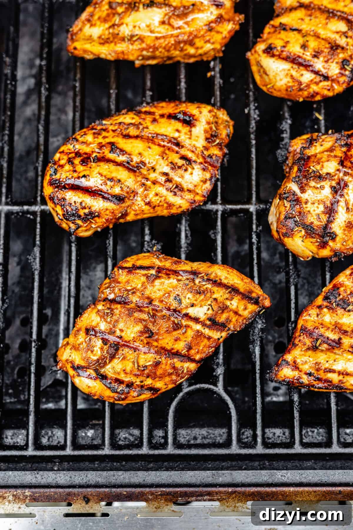 Smoky Grilled Cajun Chicken Recipe 5 Cajun Chicken cooking on grill.