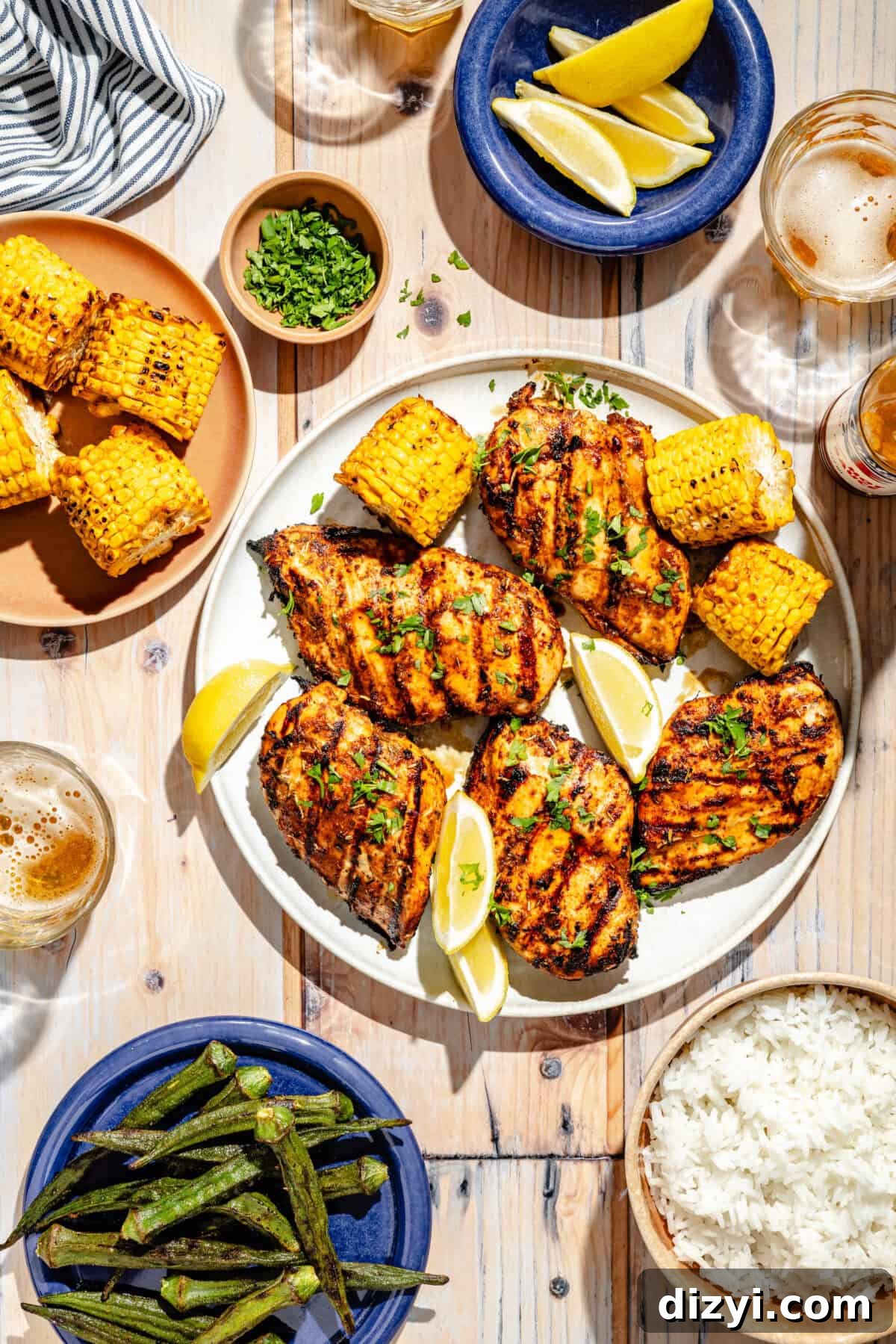 Smoky Grilled Cajun Chicken Recipe 6 Grilled Cajun Chicken on plate with side plates of rice and okra.