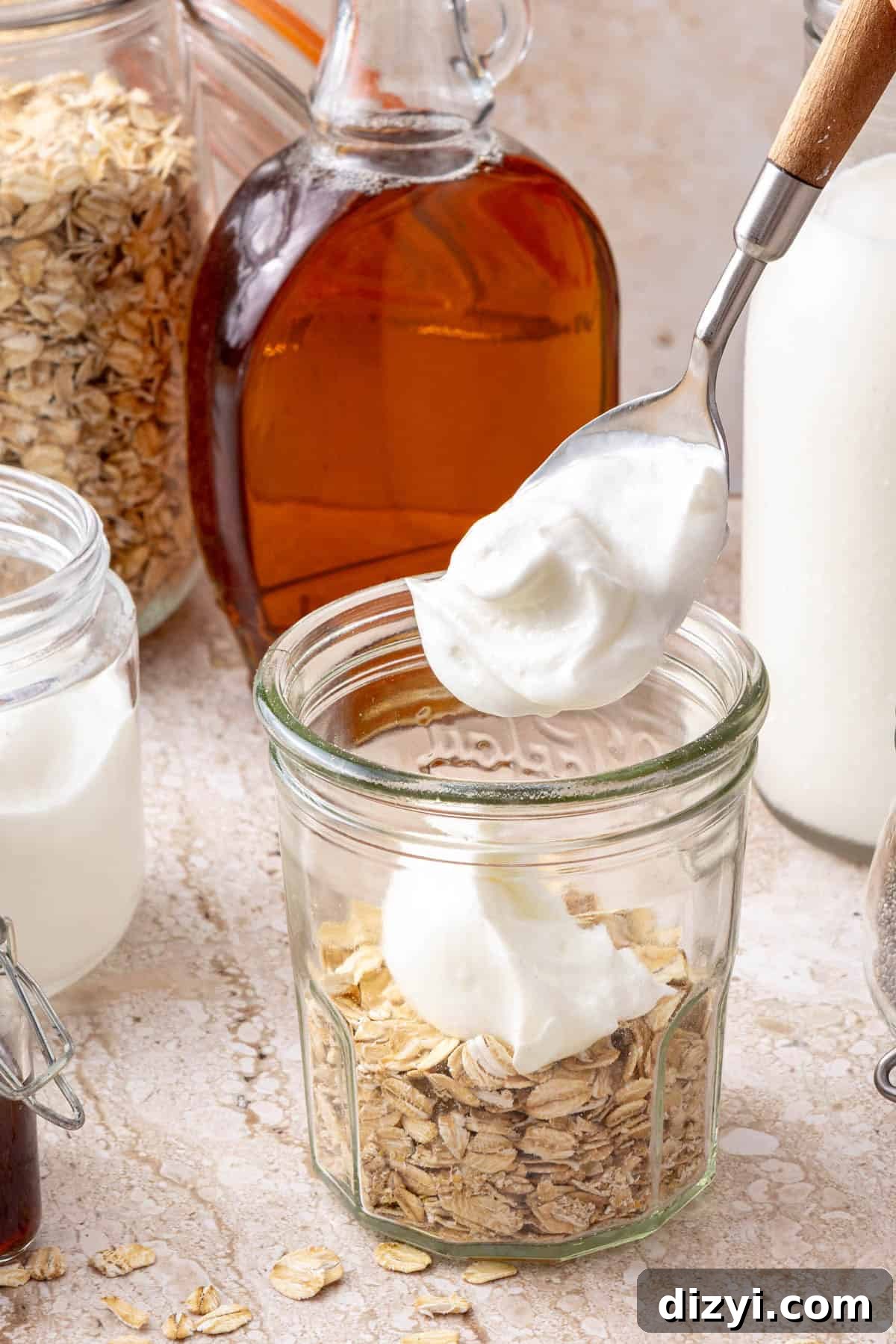 Overnight Oats Recipes: 3 Flavorful Breakfast Ideas 5 Oats in jar with yogurt going on top.