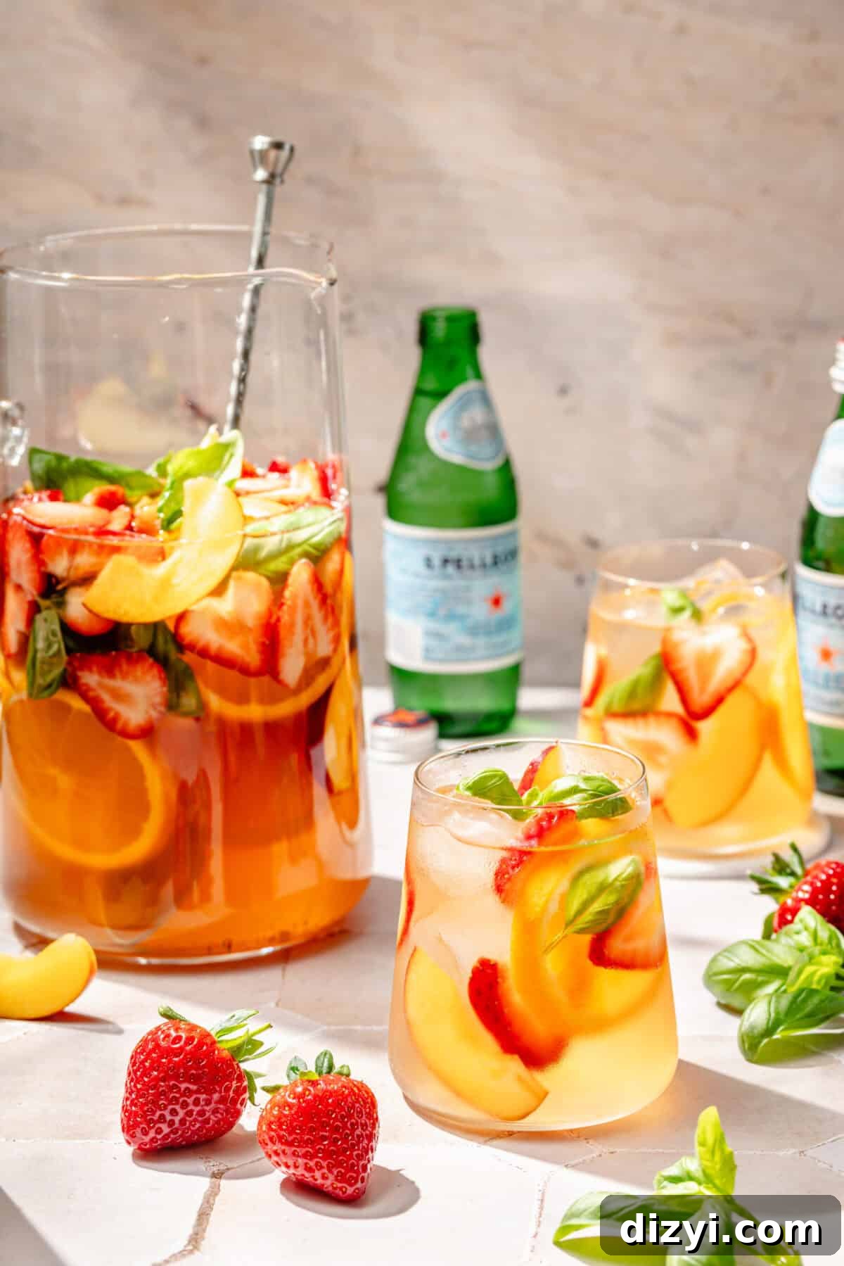 Refreshing Rosé Sangria for Summer Gatherings 3 Summer Rosé Sangria in glasses and pitcher