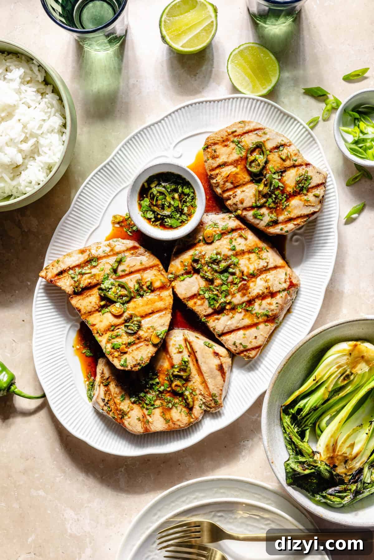 Grilled Ahi Tuna with Ponzu Lime Marinade Recipe 2 Grilled Ahi Tuna with Ponzu-Lime Marinade on platter with additional serving items around it.