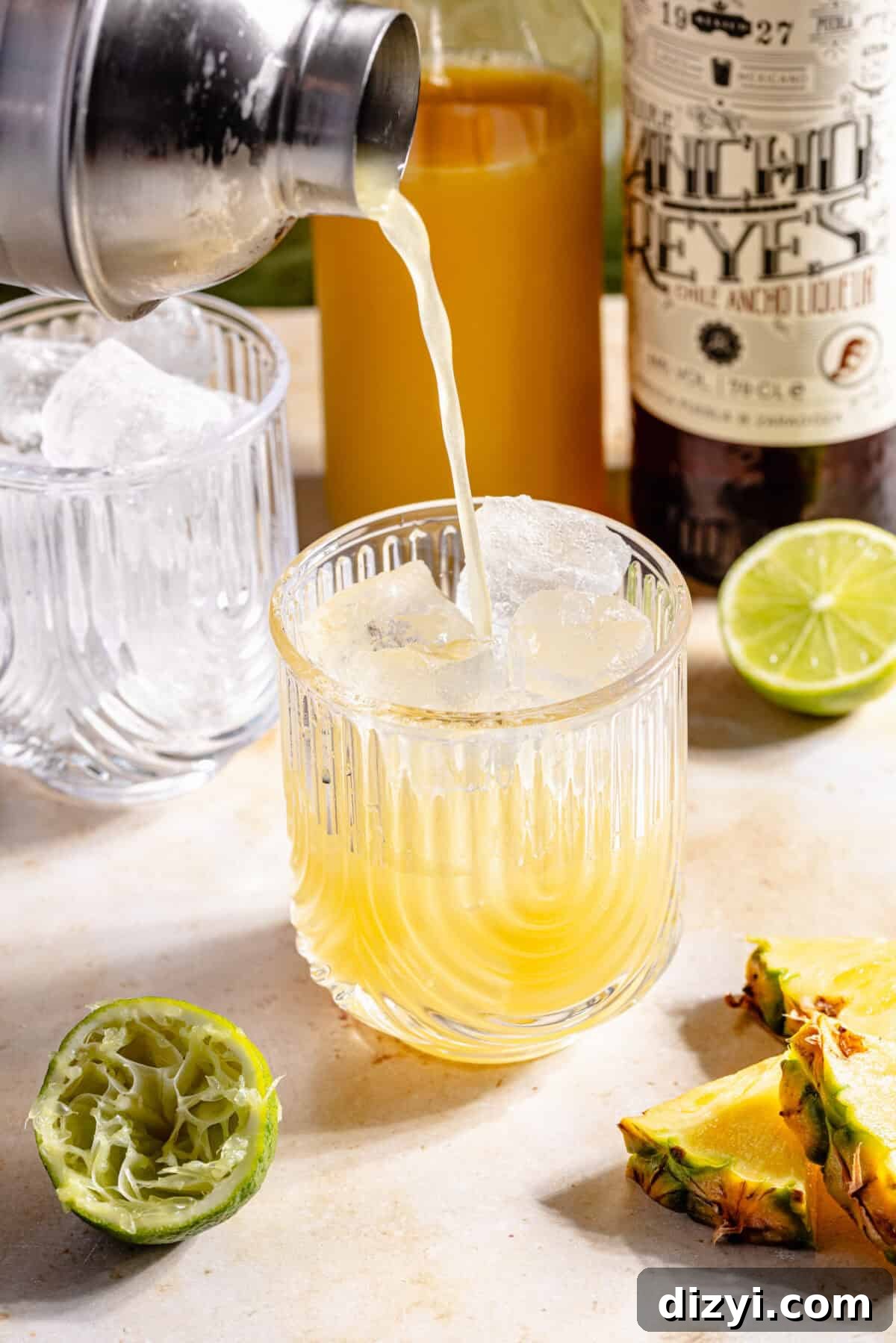Kauai Margarita: Smoky Pineapple Cocktail Recipe 4 The Kauai Margarita pouring into a glass.