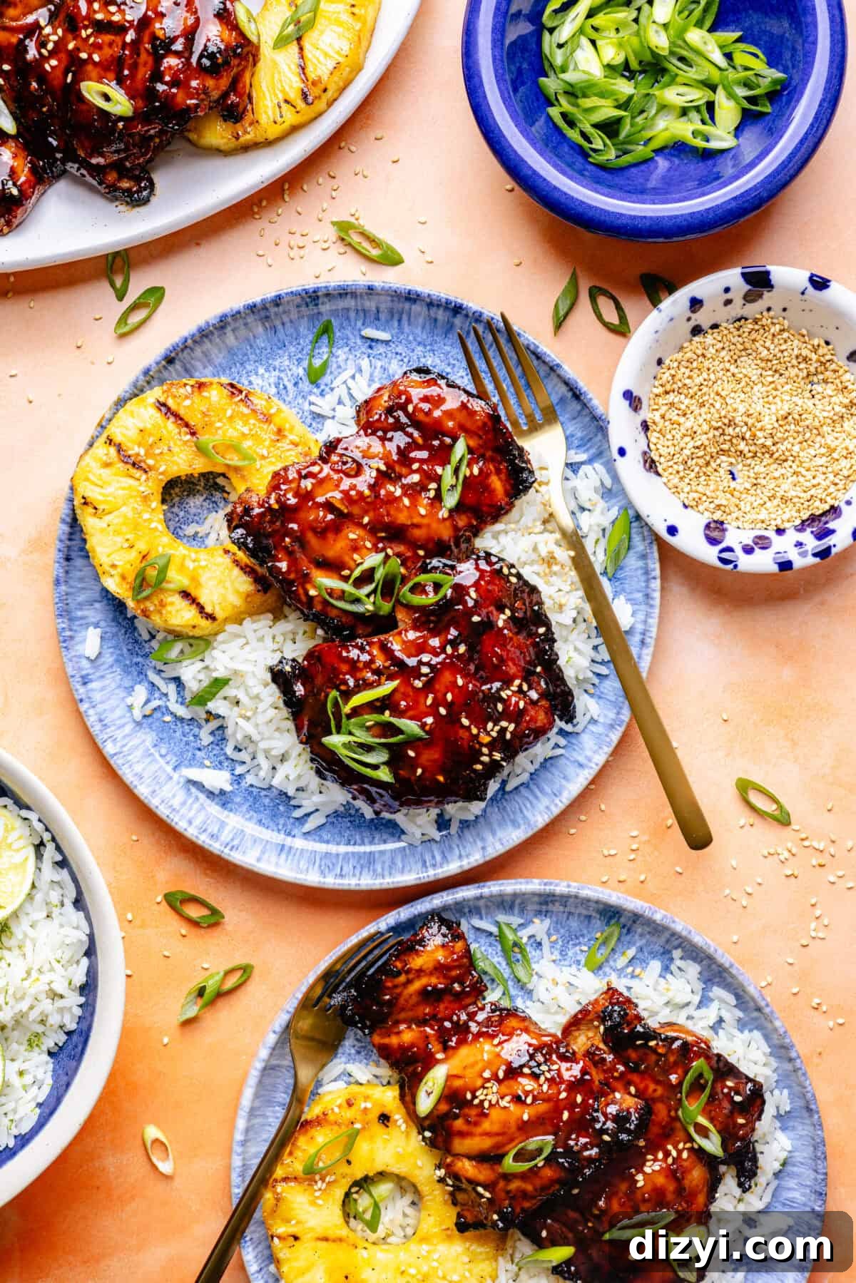 Grilled Huli Huli–Inspired Chicken in bowl with rice and grilled pineapple.