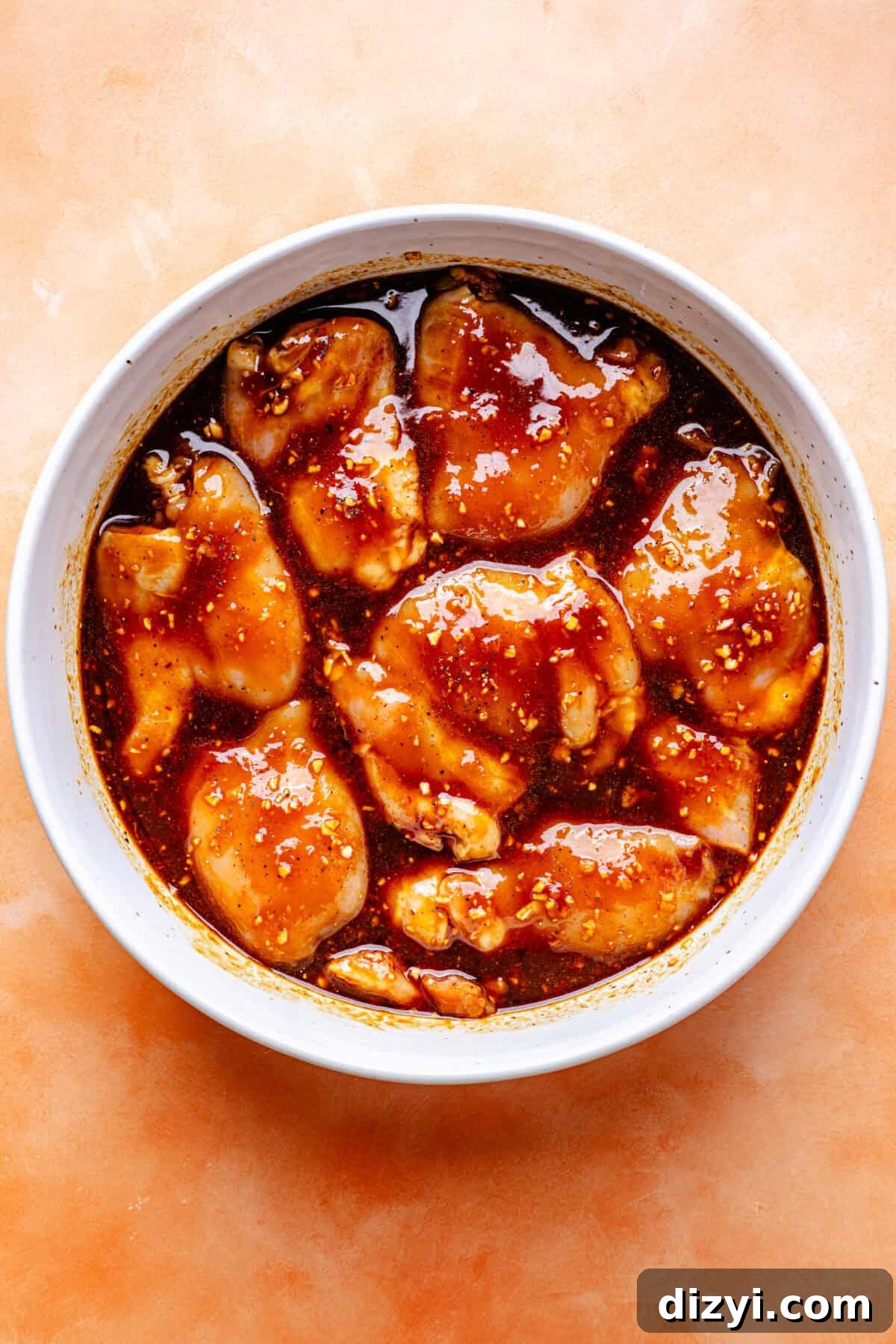 Huli Huli–Inspired Chicken marinading in bowl.