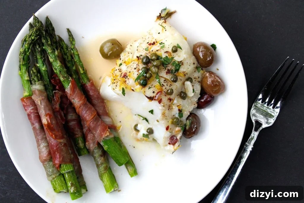 Closeup of cod with lemon and capers
