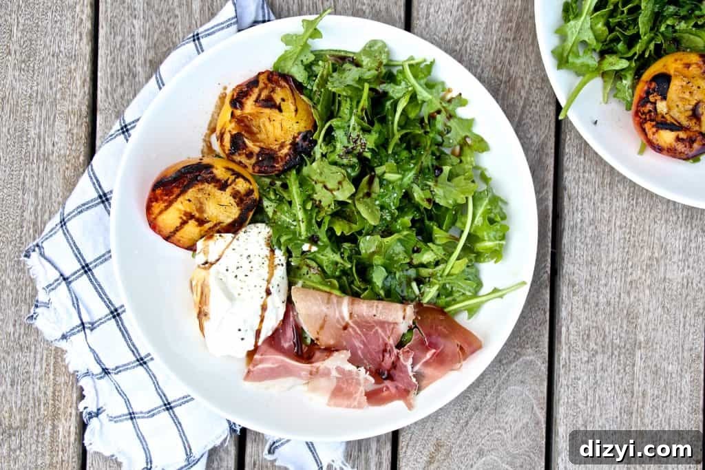 Grilled peach and arugula salad with burrata and prosciutto
