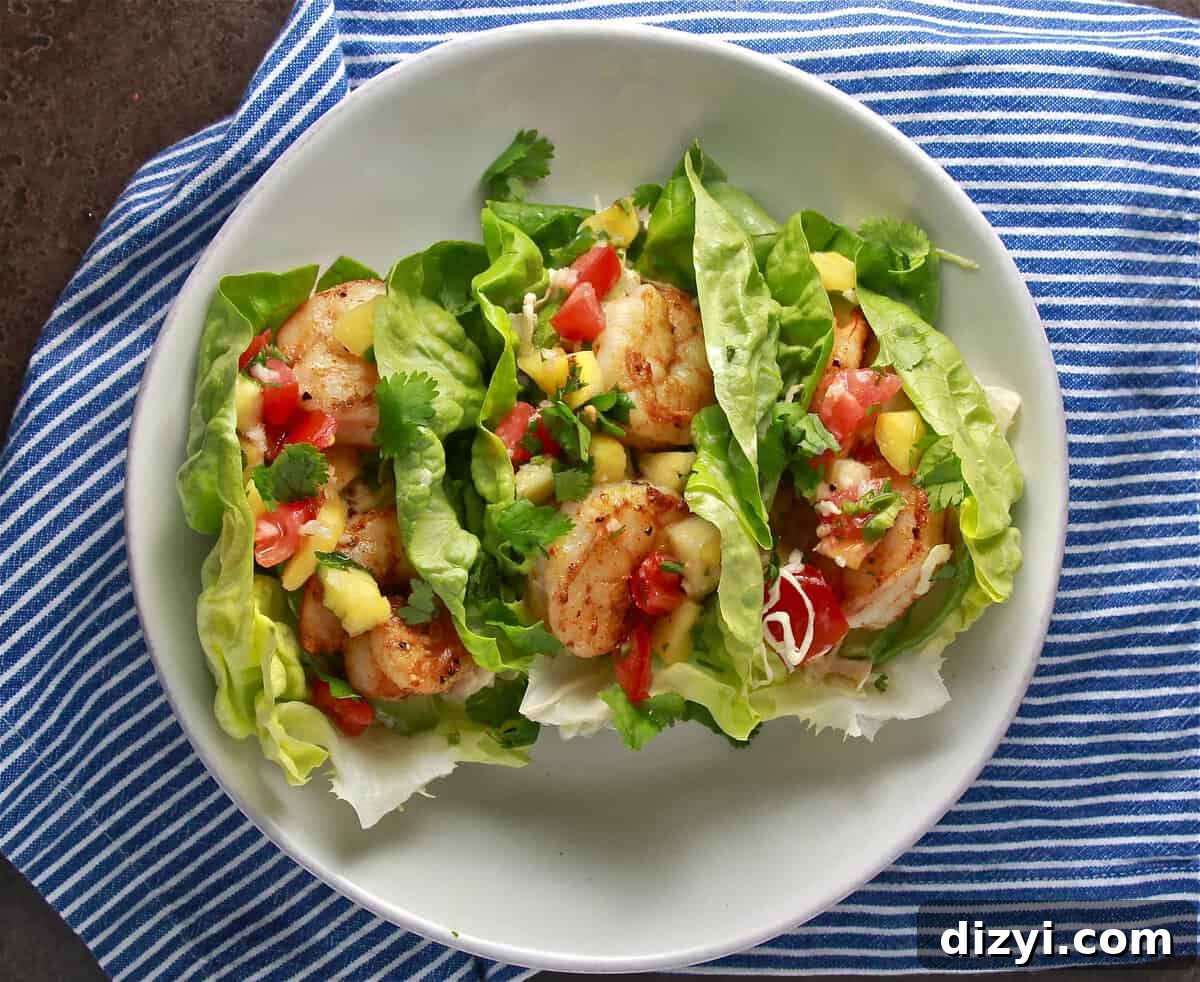 Plated shrimp tacos with pineapple pico
