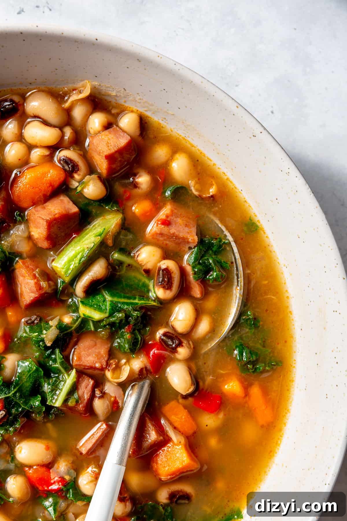 Close up of Black-Eyed Pea Soup in white bowl.