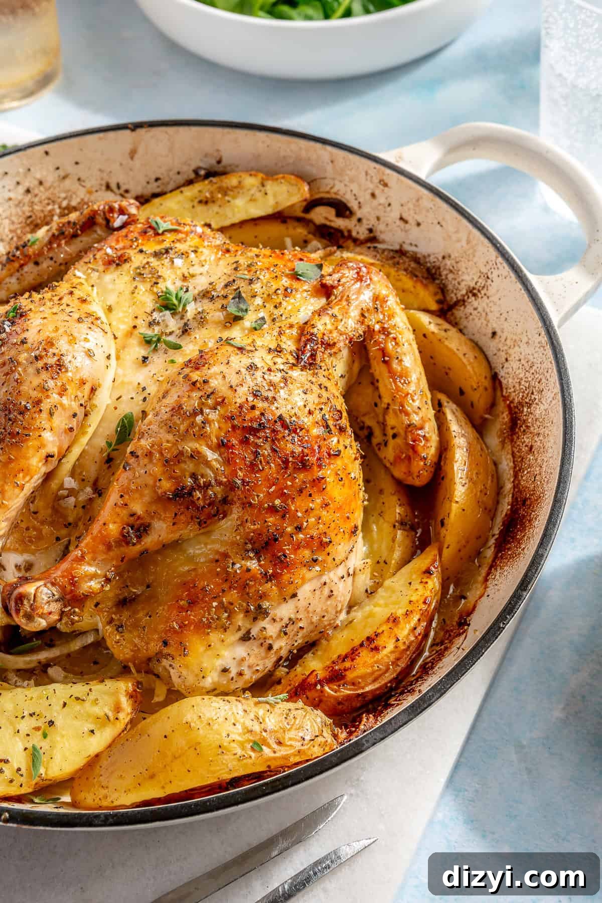 Whole Greek Roast Chicken with Lemon Potatoes 2 Whole Roasted Greek Chicken and Potatoes in white baking dish.