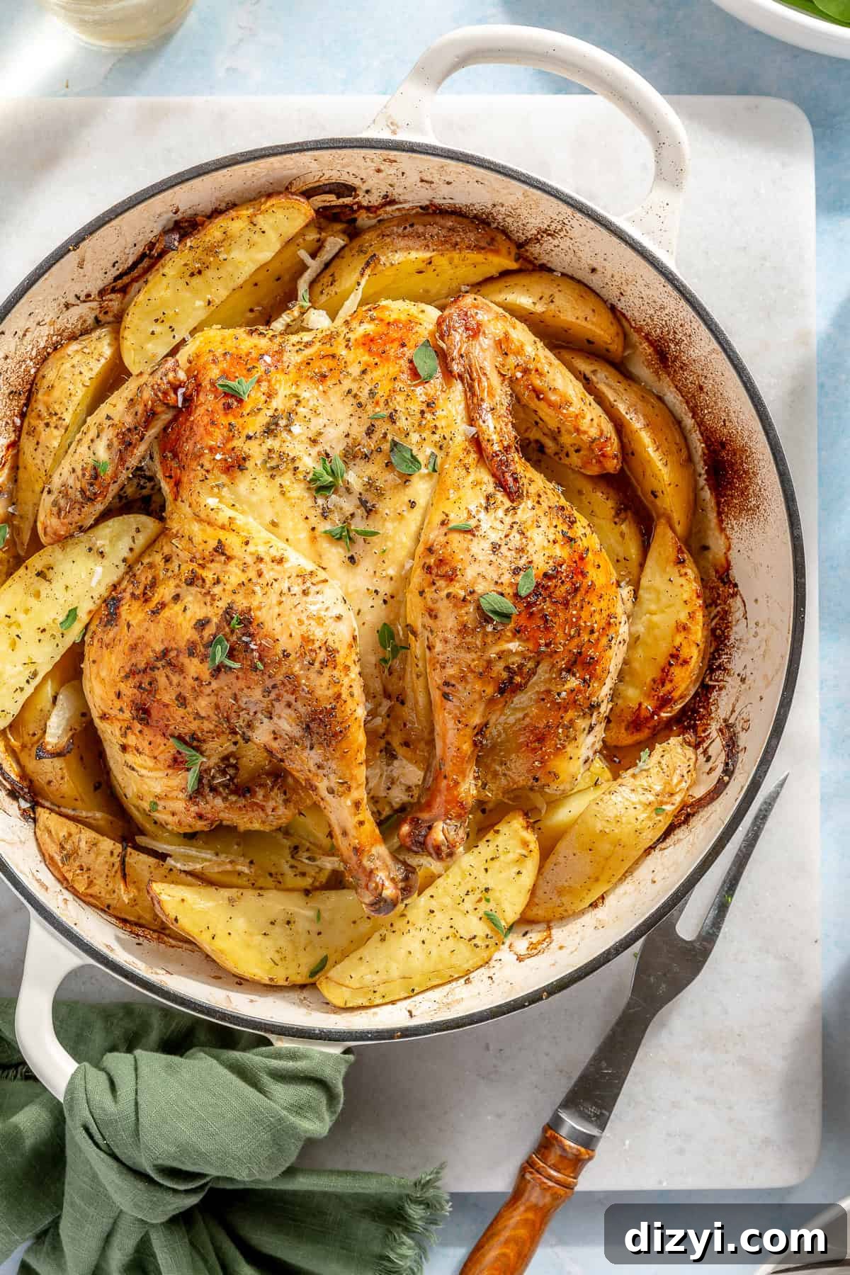 Whole Greek Roast Chicken with Lemon Potatoes 3 Whole Roasted Greek Chicken and Potatoes in white dutch oven.