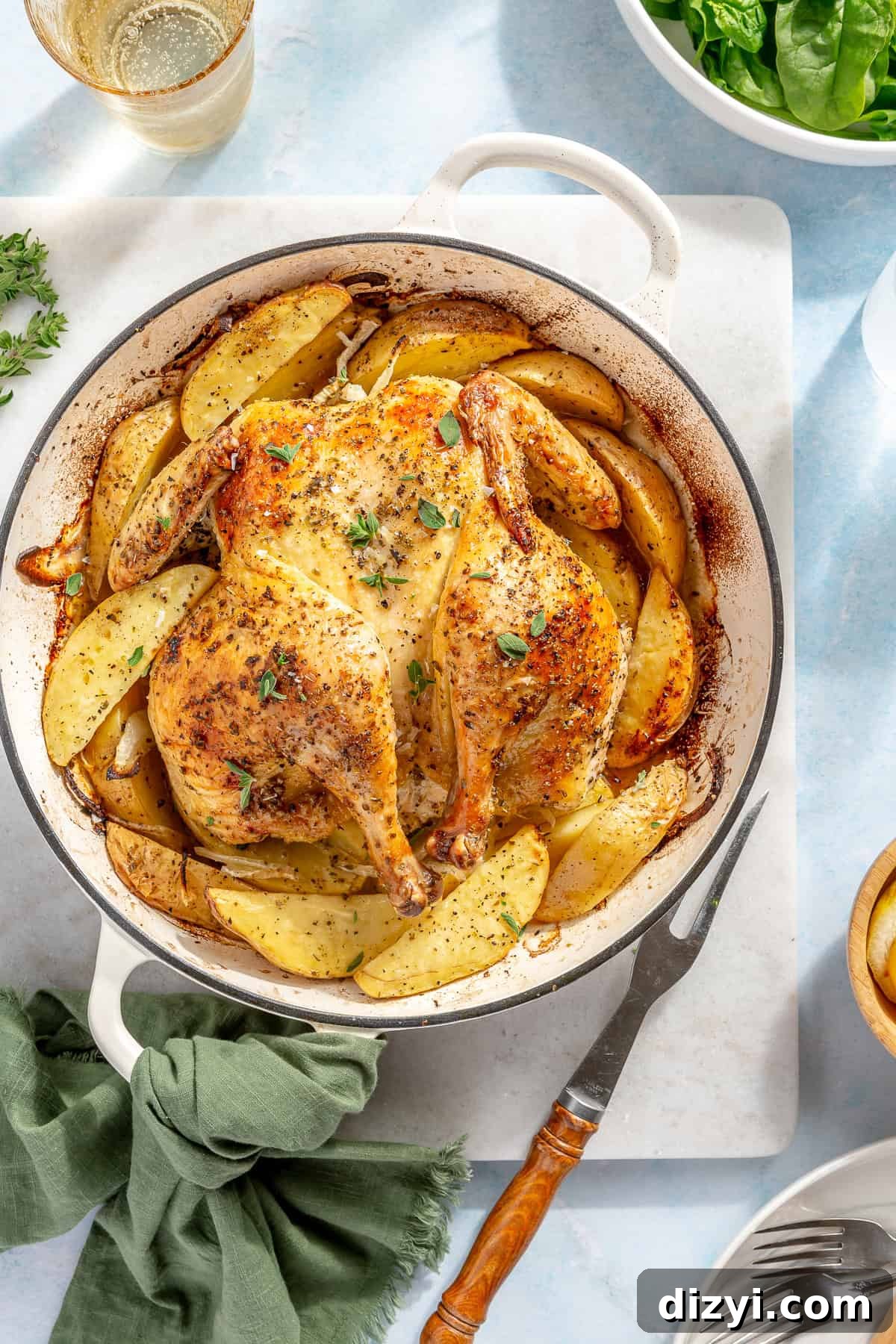 Whole Greek Roast Chicken with Lemon Potatoes 7 Whole Roasted Greek Chicken and Potatoes in white dutch oven.
