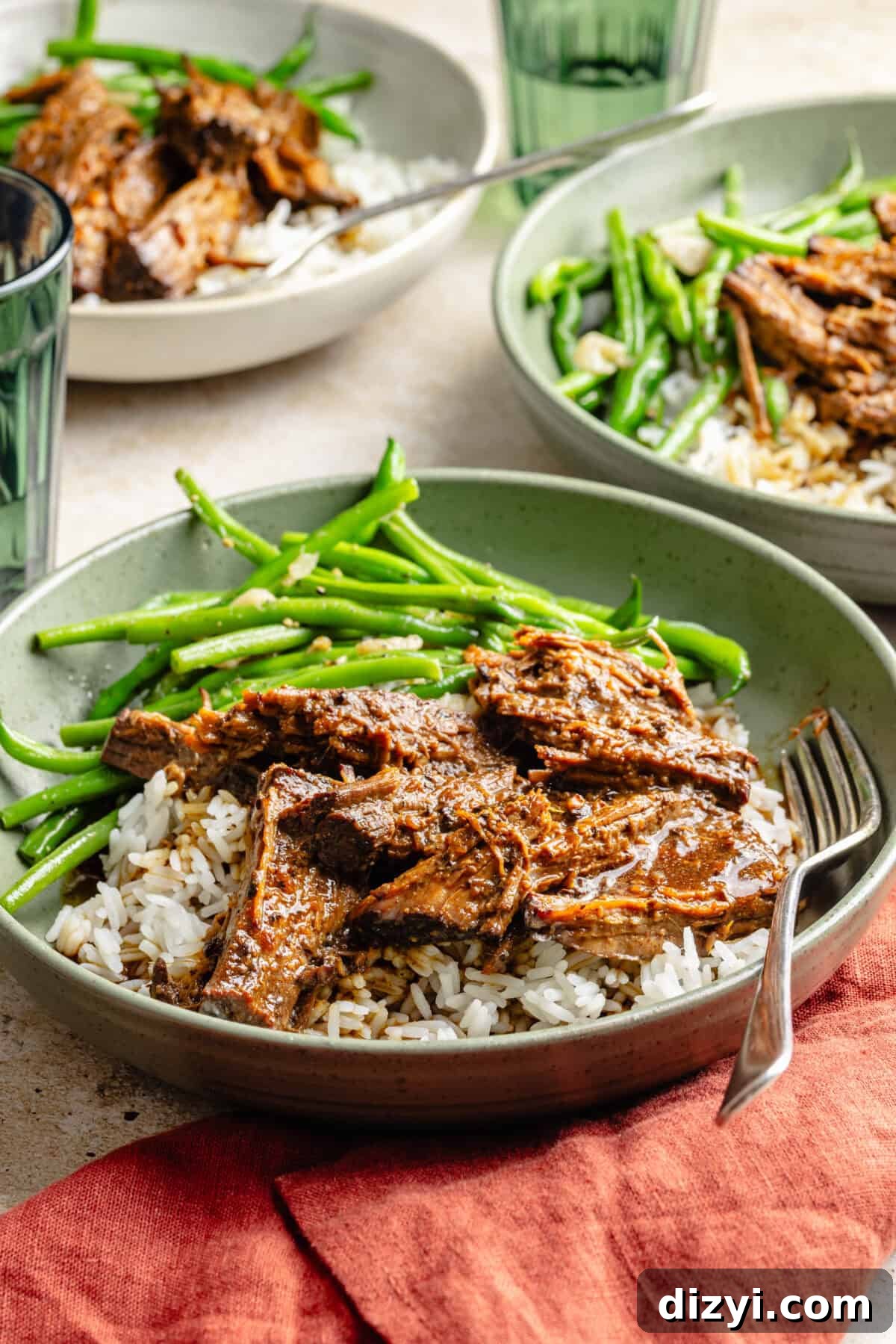 Slow Cooker Miso Ginger Chuck Roast Recipe 3 Slow Cooker Miso-Ginger Chuck Roast plated with rice and green beans.