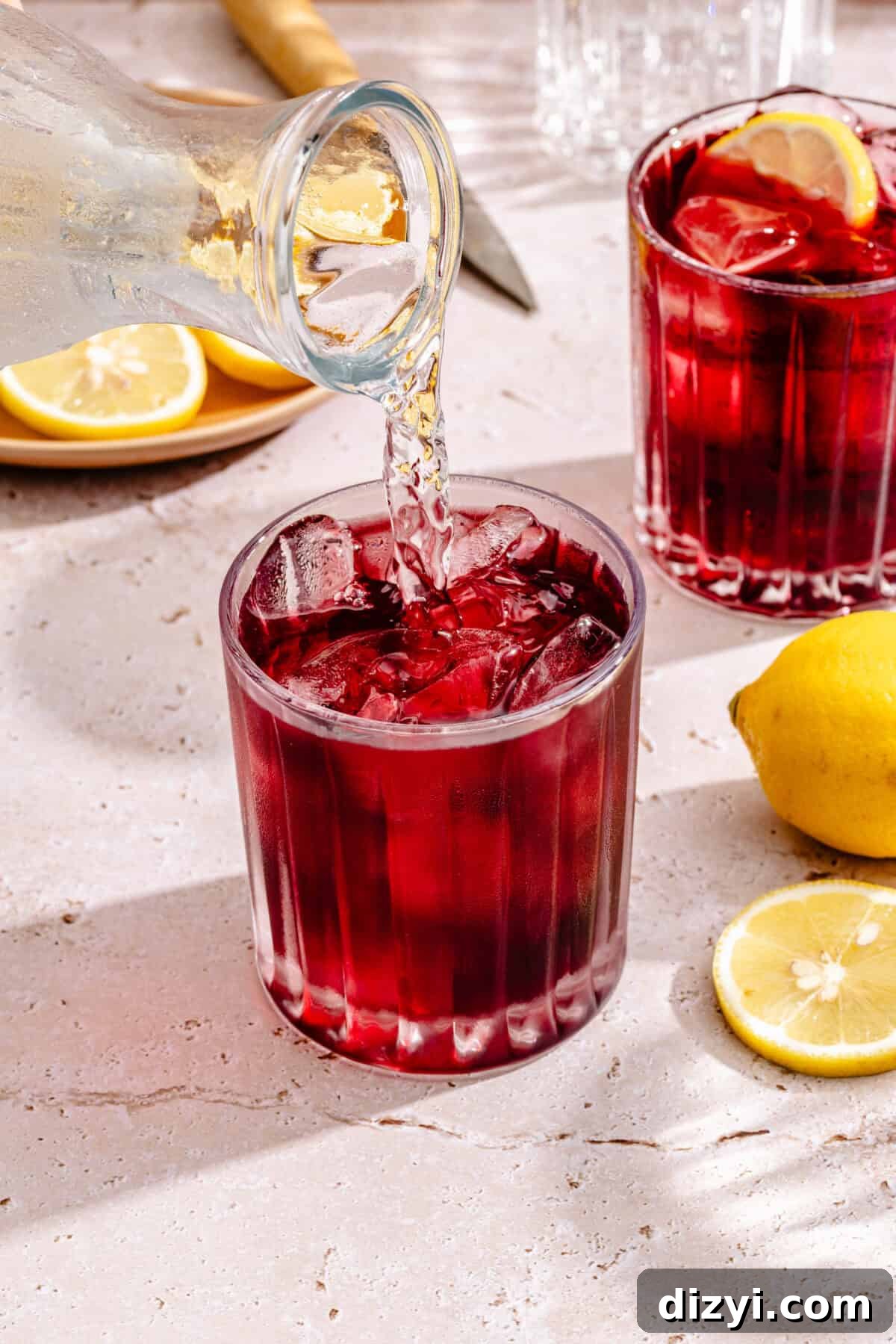 Tinto de Verano: Spanish Summer Wine Cocktail Recipe 5 Tinto de Verano in glass with sparkling water pouring in.