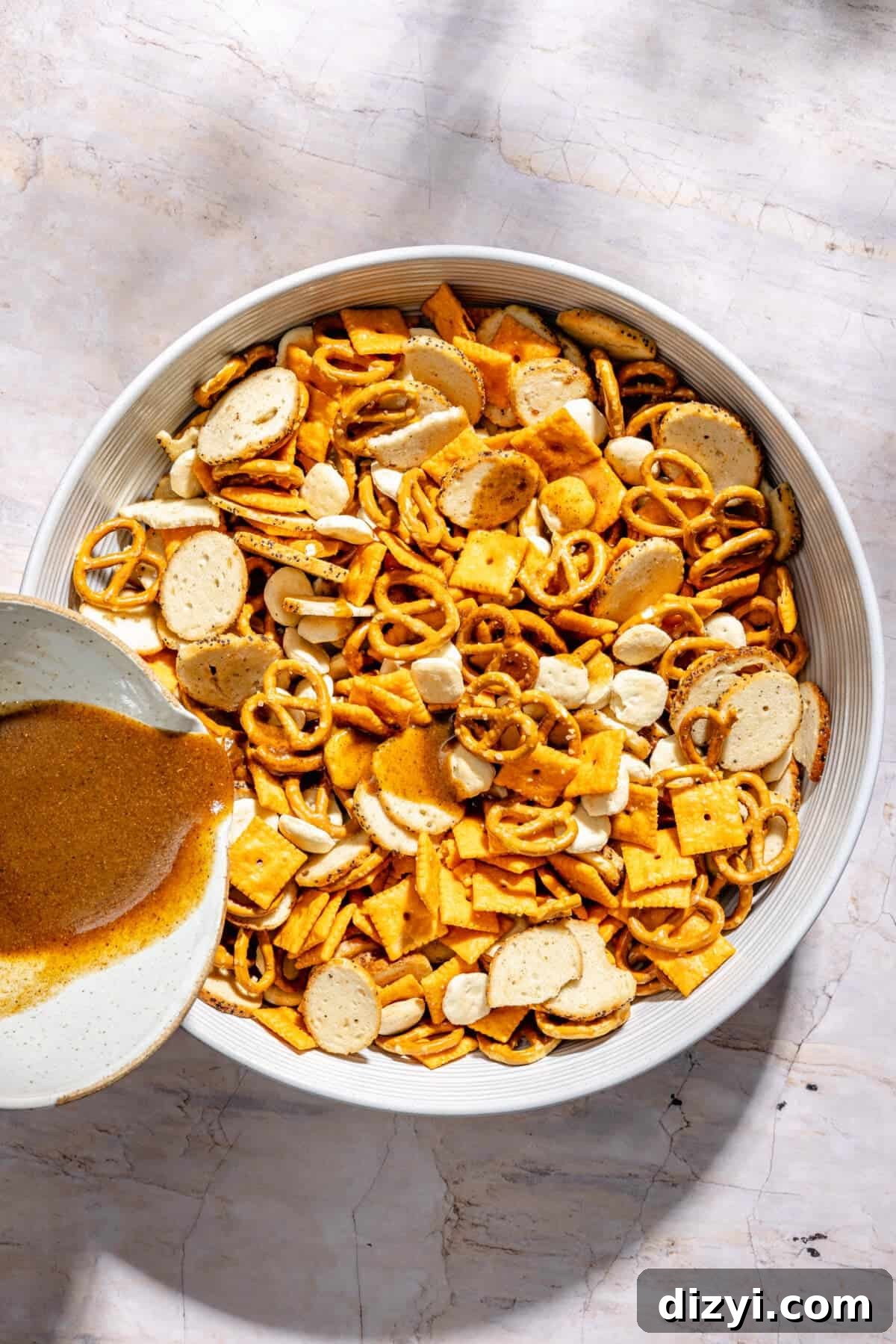 Cajun Cheddar Snack Mix in large mixing bowl.