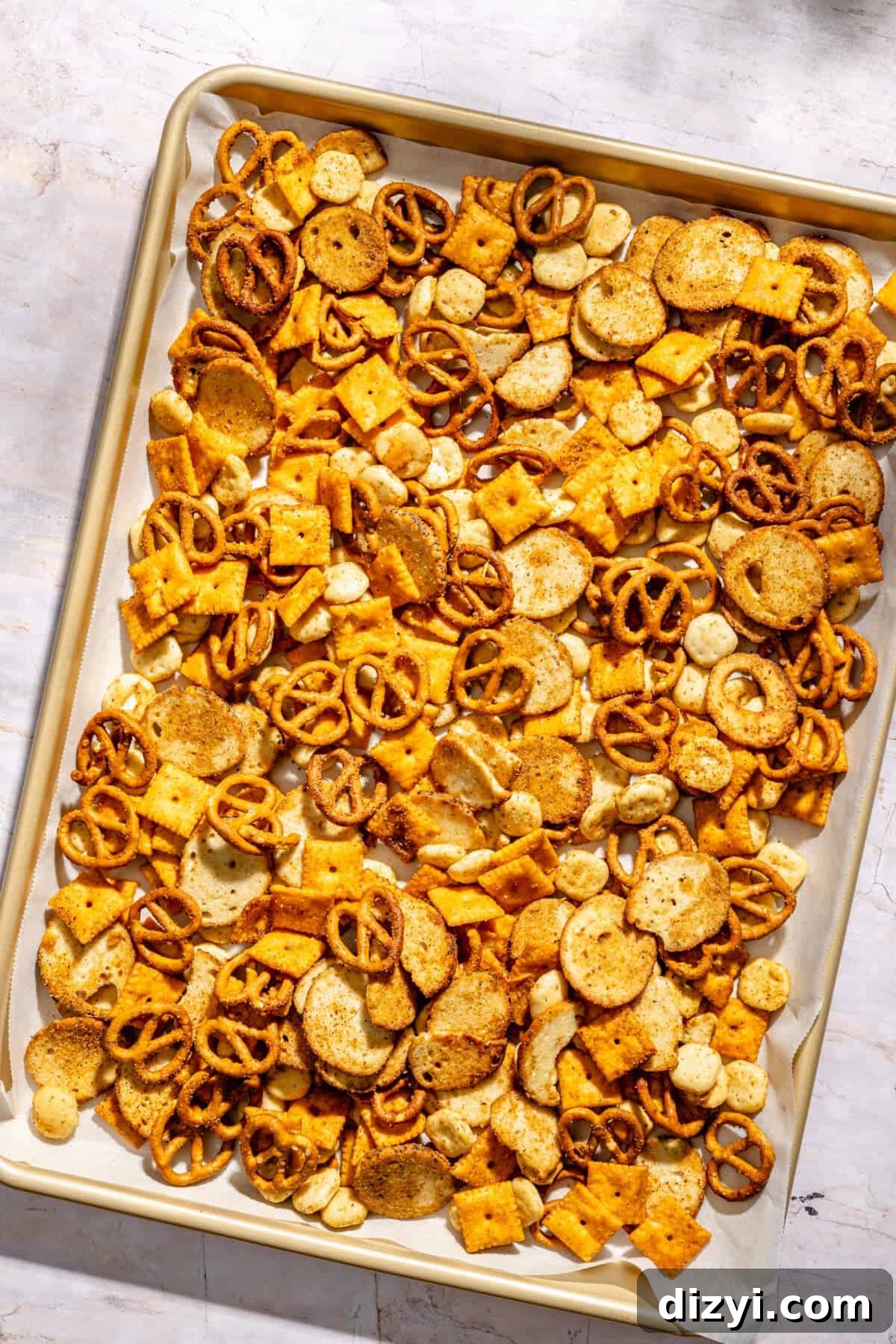 Cajun Cheddar Snack Mix on sheet pan before baking.