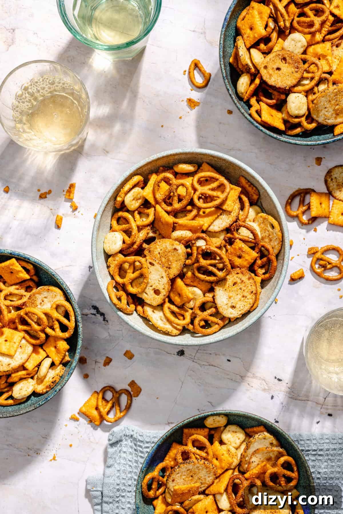 Cajun Cheddar Snack Mix in various serving bowls.