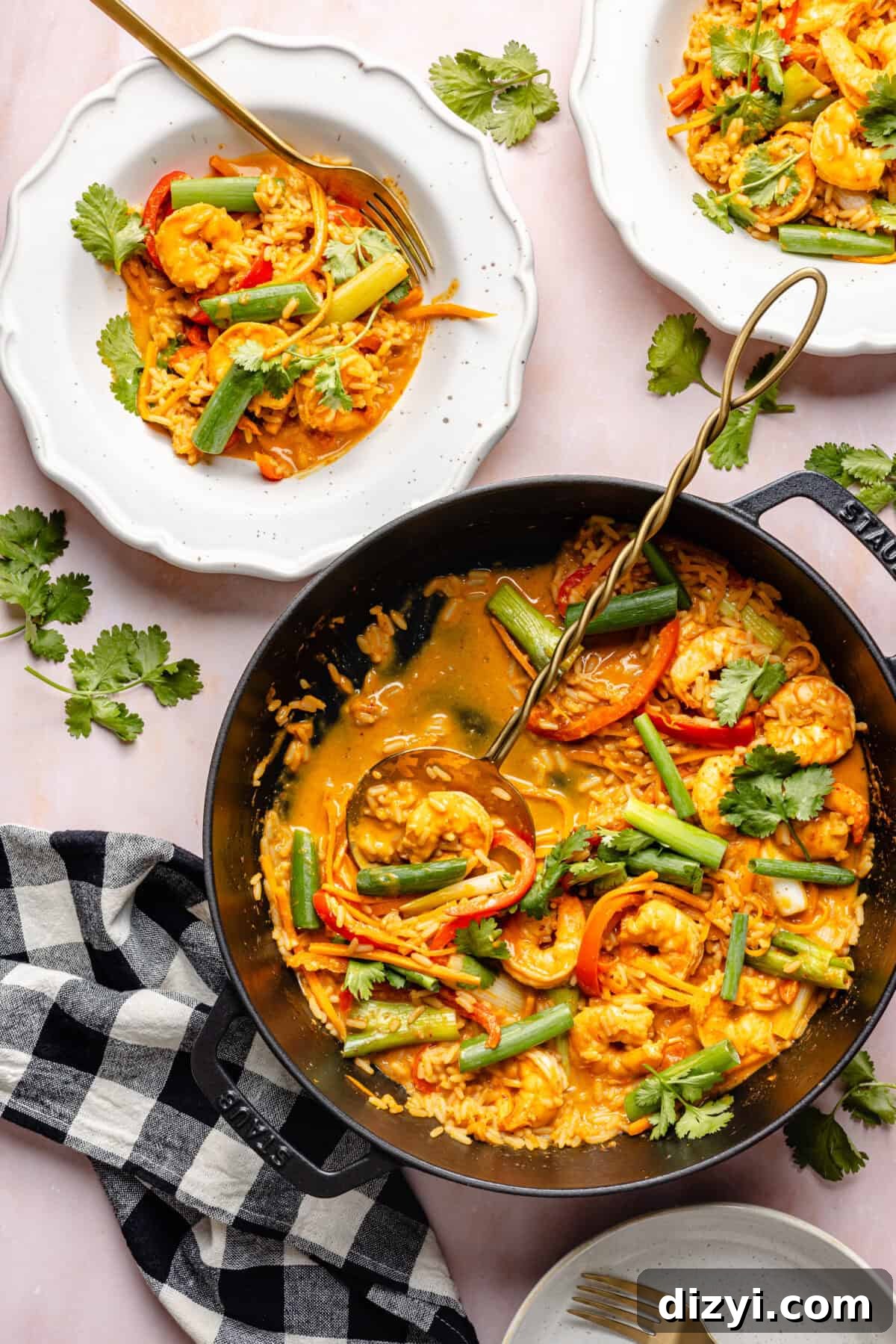 20-Minute Thai-Inspired Coconut Shrimp Curry in skillet and serving bowls.